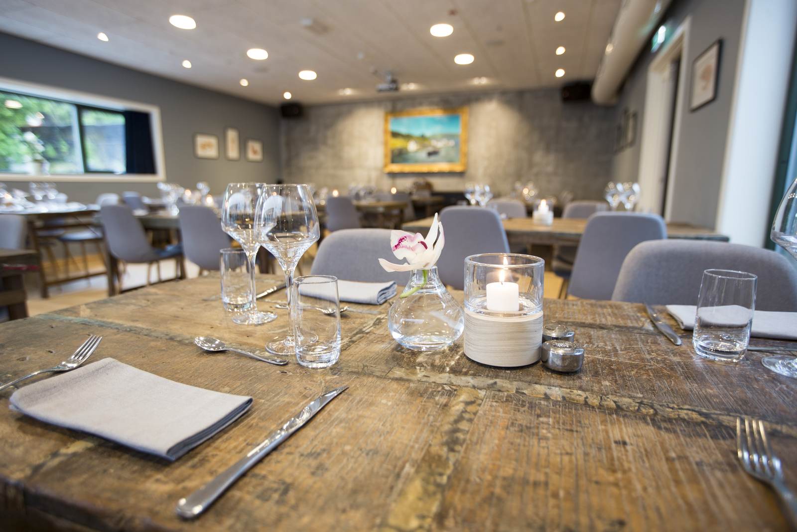 The banquet hall with velour curtains and rustic tables